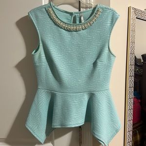 Crewneck Baby Blue peplum shirt with pearls around the neckline